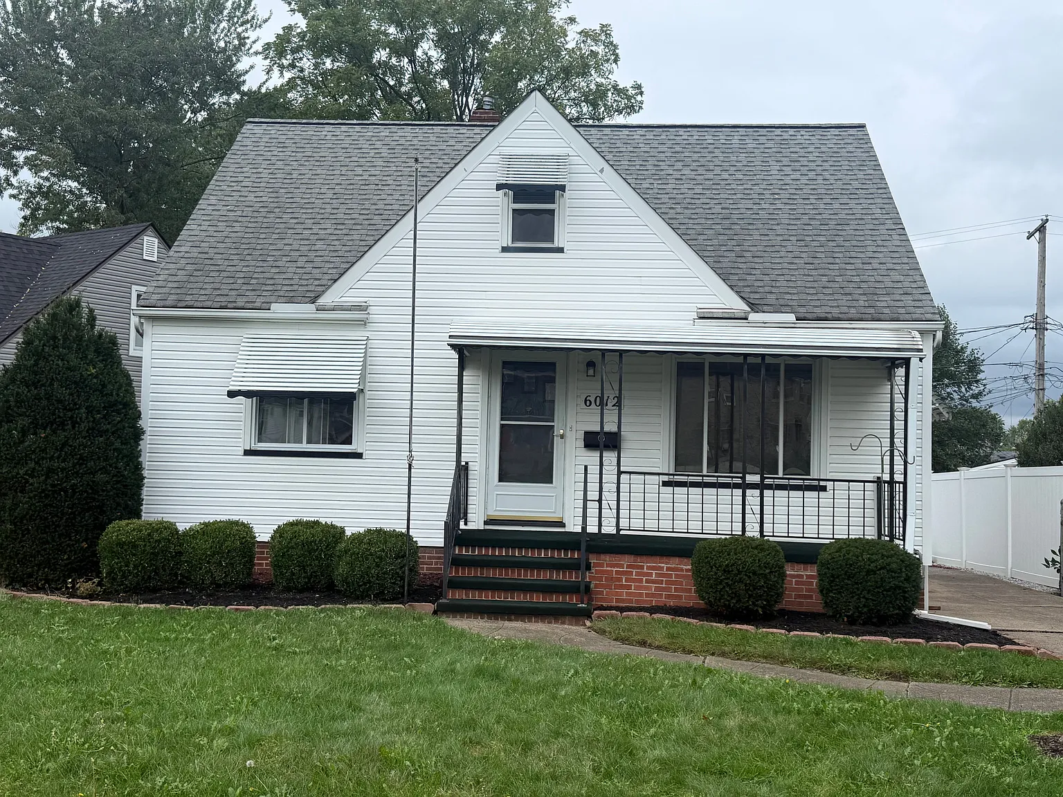 Front exterior of 6012 Thornton Drive with a covered porch and landscaped lawn